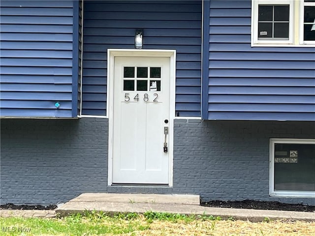 5482 Pleasant St, North Ridgeville, OH 44039 - entrance to property with brick siding