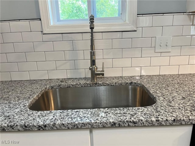 5482 Pleasant St, North Ridgeville, OH 44039 - kitchen view of backsplash and light stone counters