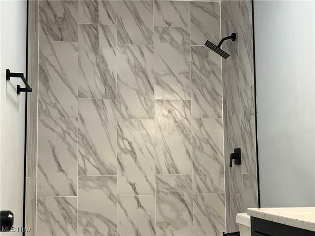 5482 Pleasant St, North Ridgeville, OH 44039 - full bathroom with a tile shower and vanity