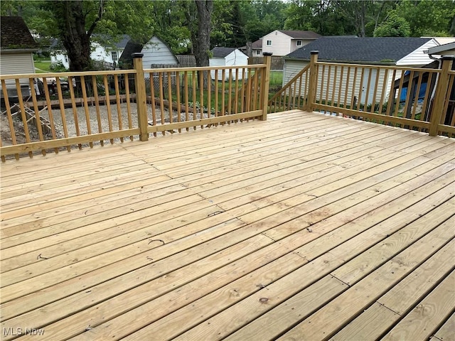 5482 Pleasant St, North Ridgeville, OH 44039 - deck with a storage unit, a fenced backyard, and view of scattered trees