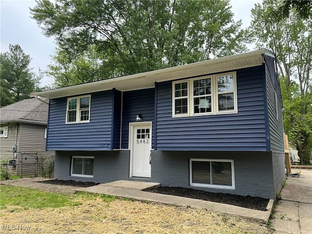 5482 Pleasant St, North Ridgeville, OH 44039 - raised ranch featuring brick siding