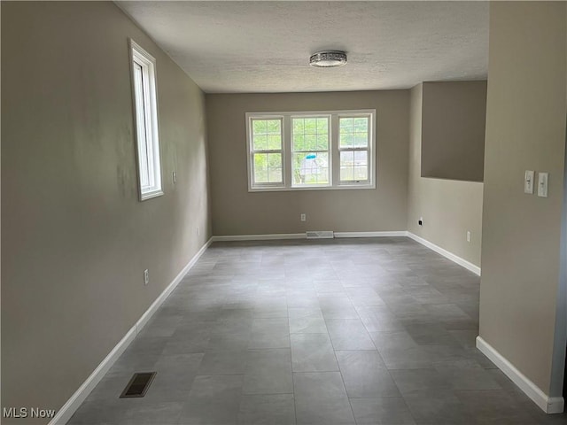 5482 Pleasant St, North Ridgeville, OH 44039 - empty room with a textured ceiling