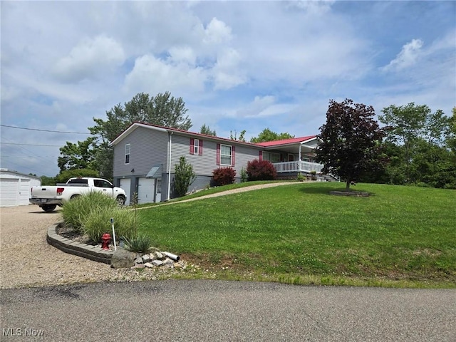 1947 N Vinegar Hill Rd NE, Mcconnelsville, OH 43756 - manufactured / mobile home featuring a garage, a front lawn, and driveway