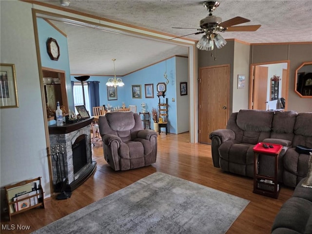 1947 N Vinegar Hill Rd NE, Mcconnelsville, OH 43756 - living area featuring wood finished floors, a textured ceiling, ceiling fan, a chandelier, and crown molding