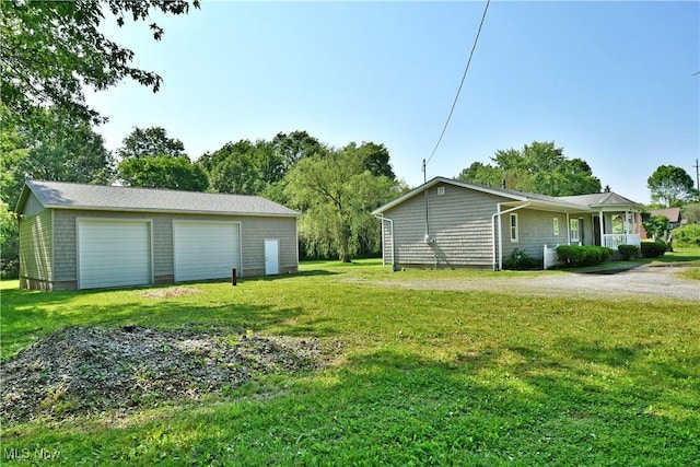 2843 N Park Ave, Warren, OH 44483 - view of grassy yard featuring an outbuilding and a detached garage