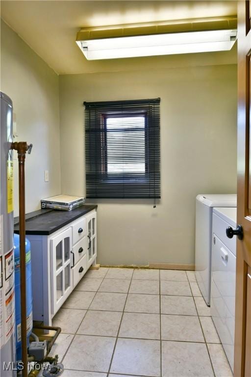 2843 N Park Ave, Warren, OH 44483 - laundry room featuring independent washer and dryer, gas water heater, and light tile patterned floors