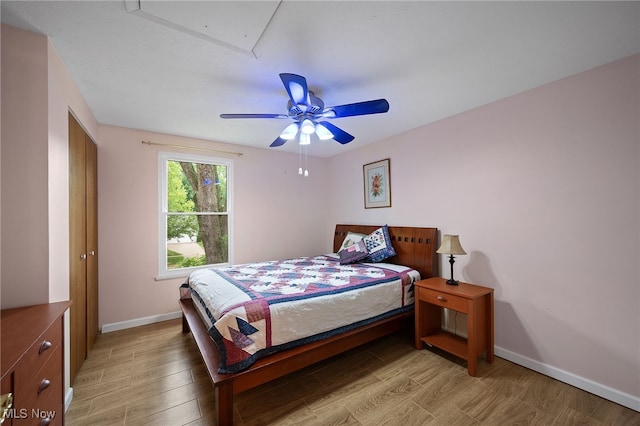 5802 Redwood Ct, Mentor-On-The-Lake, OH 44060 - bedroom with light wood finished floors and a ceiling fan