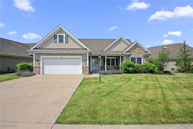 34782 Legends Way, Grafton, OH 44044 - view of front of house with stone siding, driveway, a front lawn, and a garage