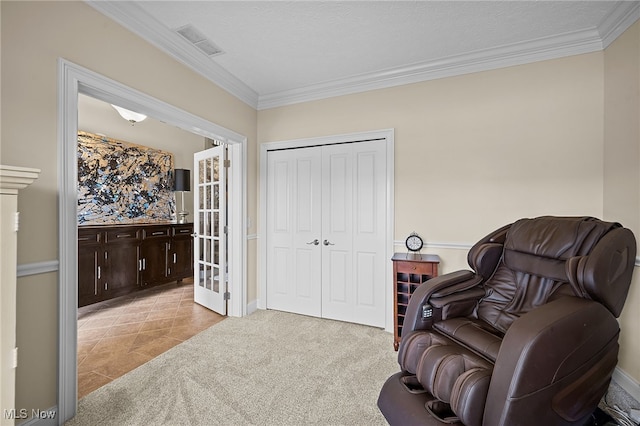 34782 Legends Way, Grafton, OH 44044 - sitting room with ornamental molding, carpet floors, and tile patterned flooring