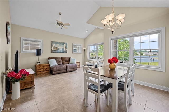 34782 Legends Way, Grafton, OH 44044 - dining space with vaulted ceiling, light tile patterned floors, a chandelier, ceiling fan, and a water view