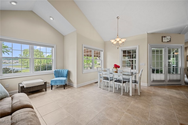 34782 Legends Way, Grafton, OH 44044 - dining space featuring a chandelier, light tile patterned floors, and high vaulted ceiling