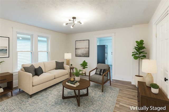1851 W 52nd St, Cleveland, OH 44102 - living area with wood finished floors and a chandelier