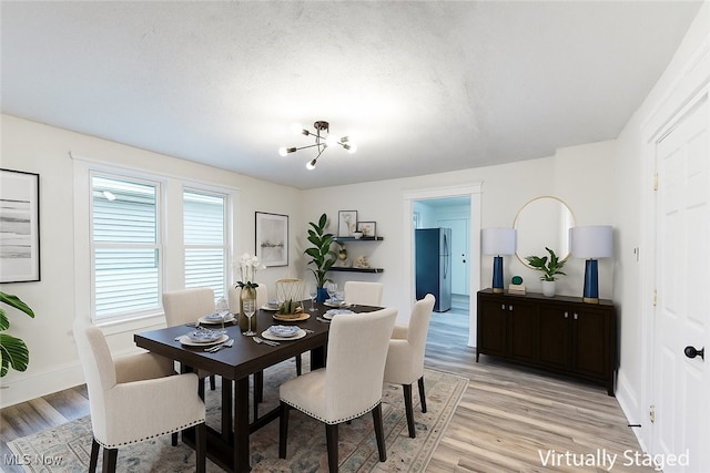1851 W 52nd St, Cleveland, OH 44102 - dining space with light wood finished floors and baseboards