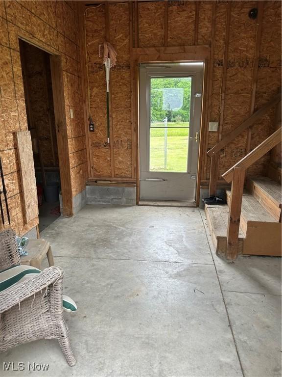4182 Reger Rd, Conneaut, OH 44030 - foyer with stairs and unfinished concrete floors