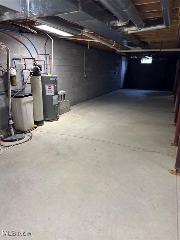 4182 Reger Rd, Conneaut, OH 44030 - unfinished below grade area featuring water heater and concrete block wall
