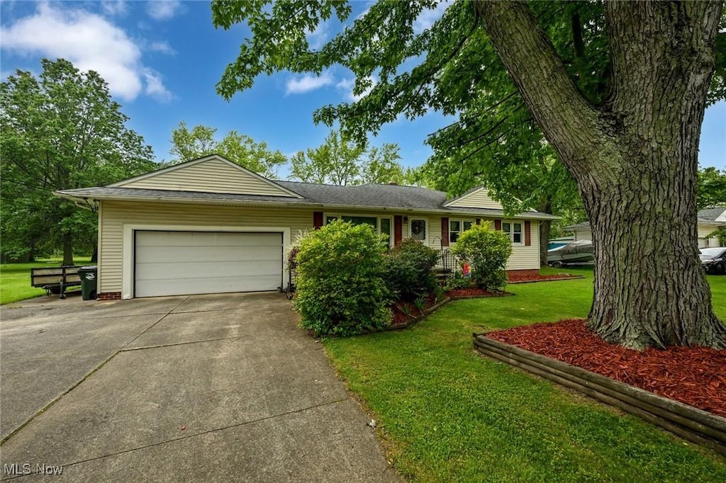 12022 Albion Rd, North Royalton, OH 44133 - ranch-style house featuring a garage, driveway, and a front lawn