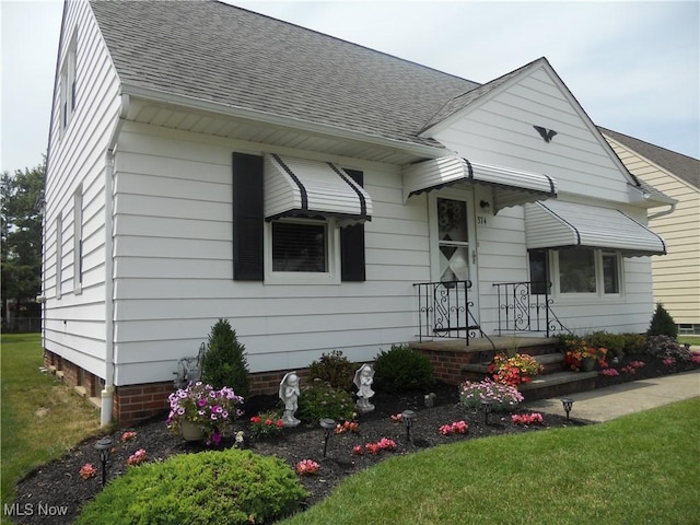 374 Clarmont Rd, Willowick, OH 44095 - view of front of house with a shingled roof