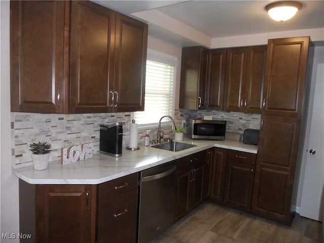 374 Clarmont Rd, Willowick, OH 44095 - kitchen with stainless steel appliances, light countertops, backsplash, and dark brown cabinetry