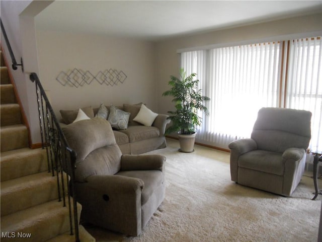 374 Clarmont Rd, Willowick, OH 44095 - living room with carpet flooring, stairs, and plenty of natural light