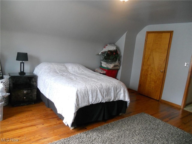 374 Clarmont Rd, Willowick, OH 44095 - bedroom with light wood-type flooring and vaulted ceiling
