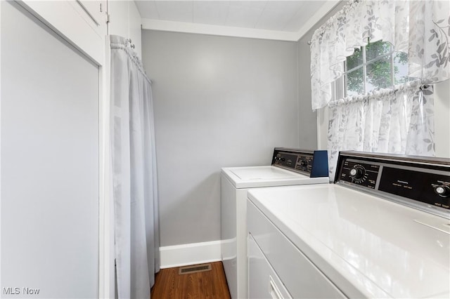 119 5th St SW, Strasburg, OH 44680 - laundry room featuring washer and dryer and dark wood-type flooring