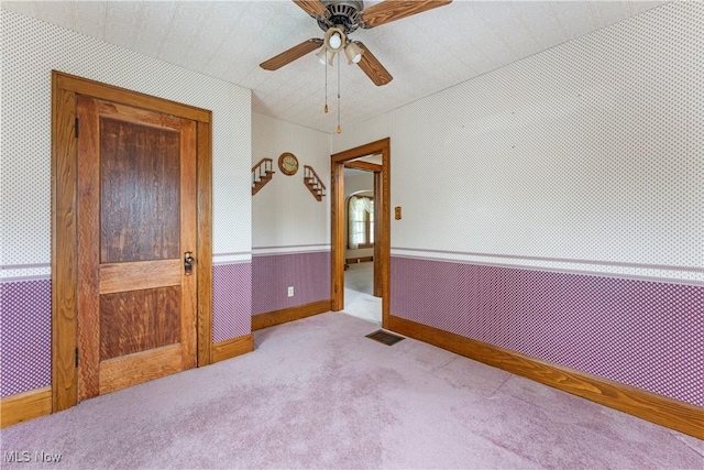 119 5th St SW, Strasburg, OH 44680 - carpeted empty room with ceiling fan and baseboards
