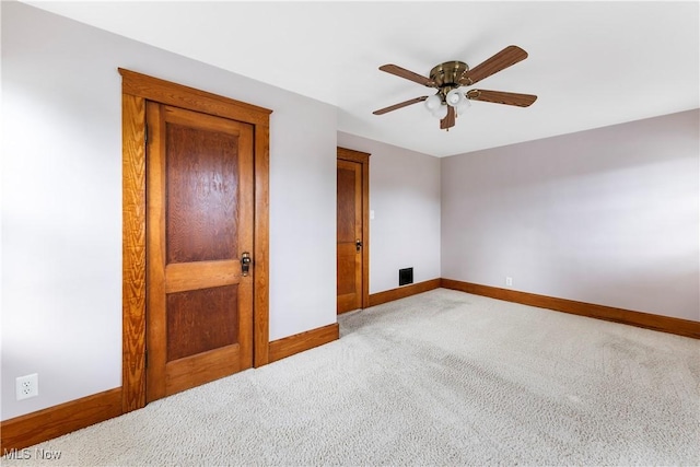 119 5th St SW, Strasburg, OH 44680 - unfurnished bedroom with light carpet and a ceiling fan