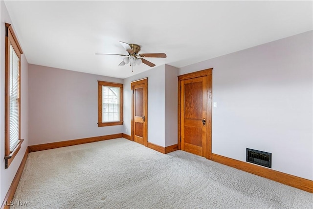 119 5th St SW, Strasburg, OH 44680 - unfurnished bedroom with carpet floors and ceiling fan