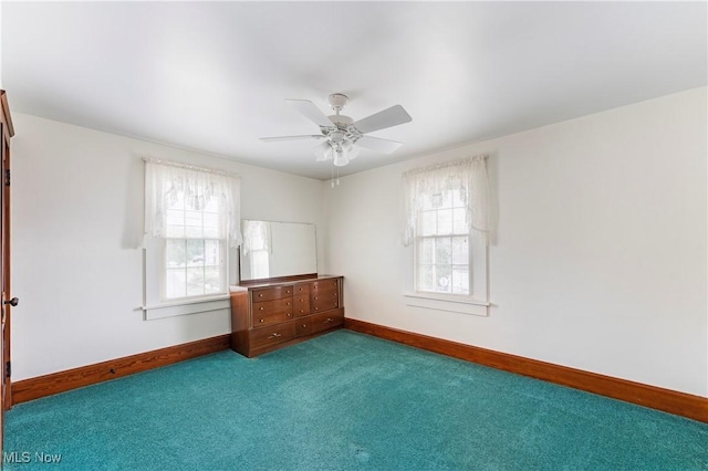 119 5th St SW, Strasburg, OH 44680 - carpeted empty room with baseboards and ceiling fan