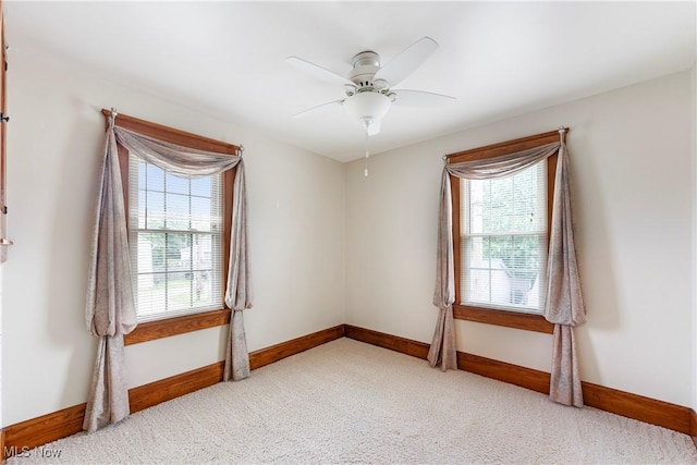 119 5th St SW, Strasburg, OH 44680 - empty room with plenty of natural light, light colored carpet, and ceiling fan