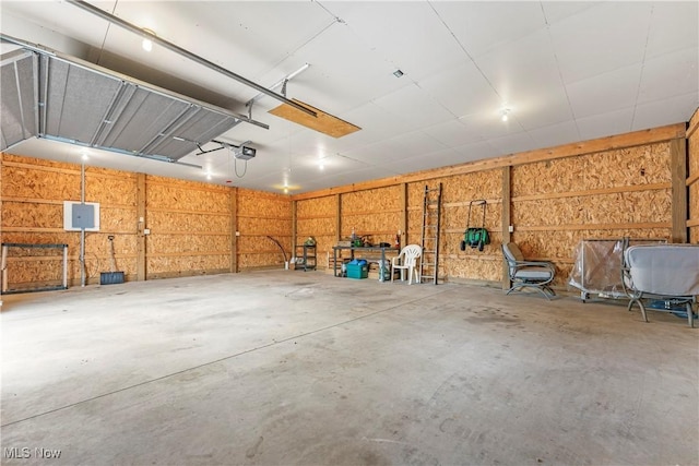 119 5th St SW, Strasburg, OH 44680 - garage featuring a garage door opener