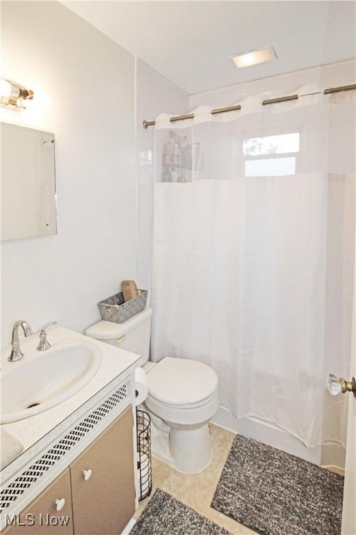 517 Linwood Ct, Port Clinton, OH 43452 - bathroom featuring vanity, shower / bath combination with curtain, and tile patterned floors