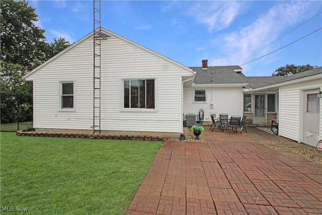 517 Linwood Ct, Port Clinton, OH 43452 - back of house featuring a lawn and a patio area