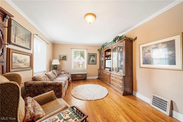 1499 Redwood Ave, Akron, OH 44301 - living room featuring plenty of natural light, light wood-type flooring, and crown molding