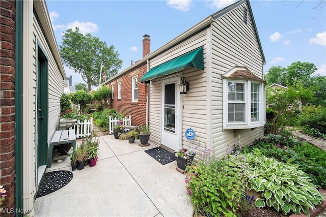 1499 Redwood Ave, Akron, OH 44301 - view of property exterior with a patio