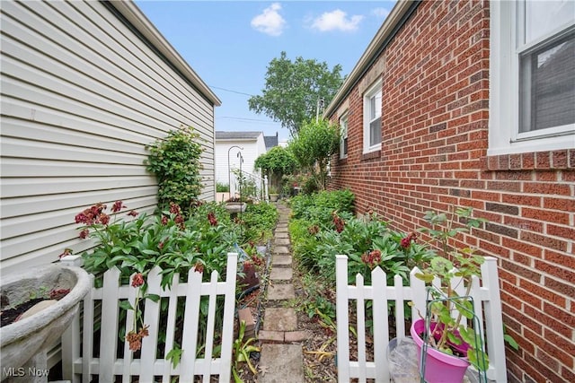 1499 Redwood Ave, Akron, OH 44301 - view of side of home with brick siding