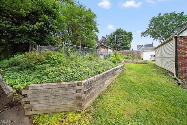 1499 Redwood Ave, Akron, OH 44301 - view of yard featuring a garden and a shed