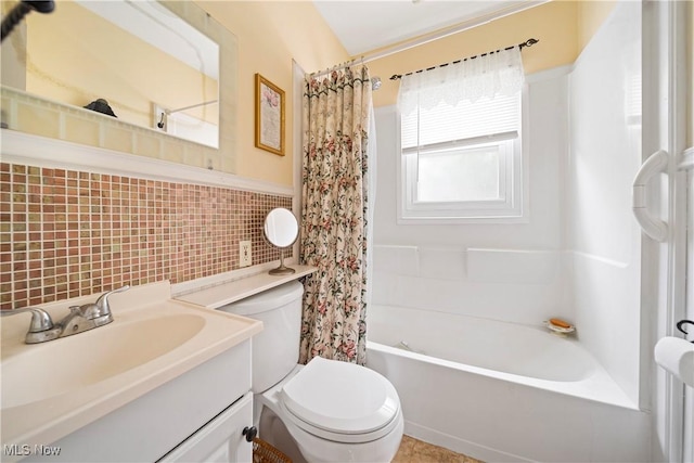 1499 Redwood Ave, Akron, OH 44301 - full bath featuring tile walls, shower / tub combo with curtain, vanity, and a wainscoted wall
