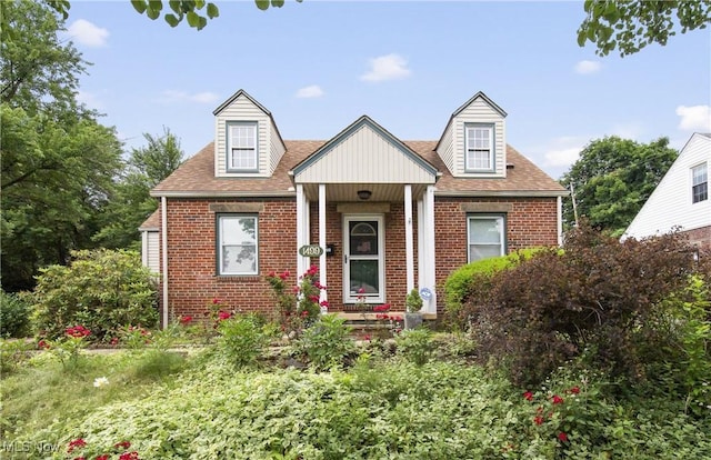 1499 Redwood Ave, Akron, OH 44301 - view of front of home featuring brick siding and roof with shingles