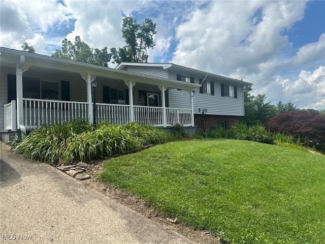 108 Janet Rd, Marietta, OH 45750 - view of property exterior featuring covered porch and a yard