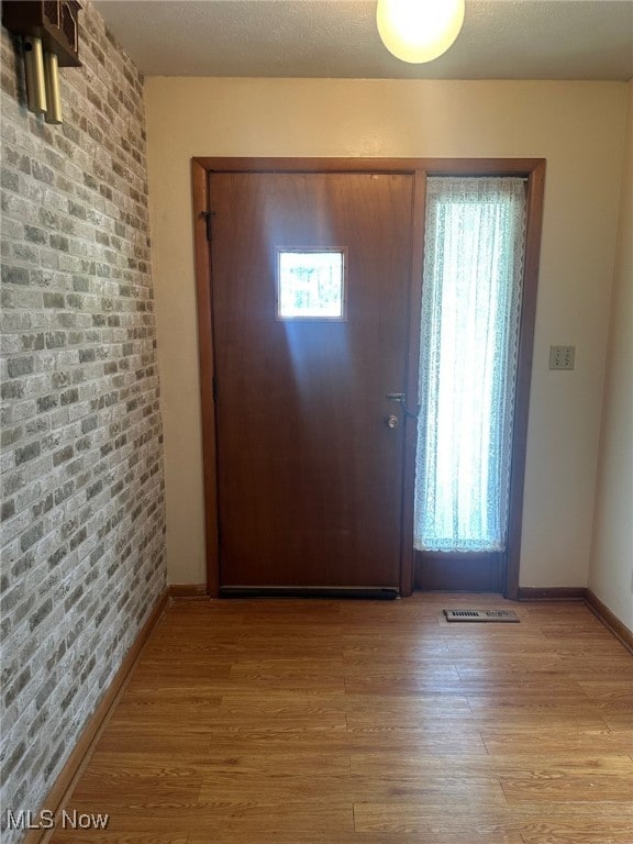 108 Janet Rd, Marietta, OH 45750 - entryway with wood finished floors and brick wall