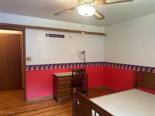 108 Janet Rd, Marietta, OH 45750 - bedroom featuring wood finished floors, a textured ceiling, and a ceiling fan