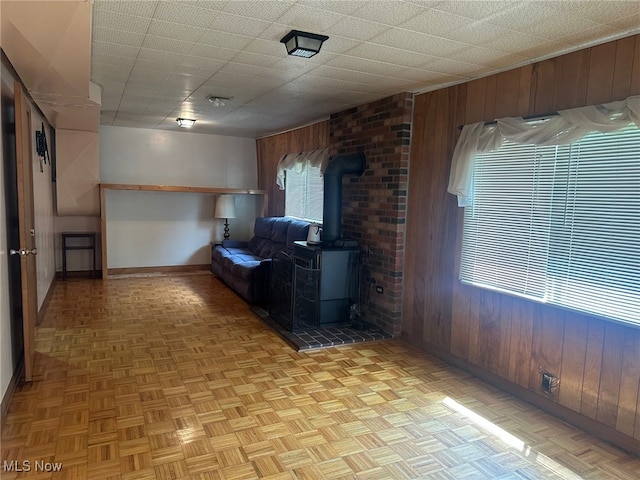 108 Janet Rd, Marietta, OH 45750 - living area featuring wood walls and a wood stove