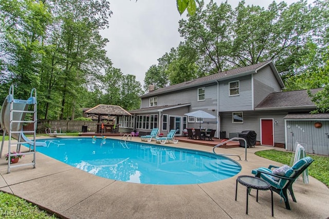 449 Westchester Dr SE, Warren, OH 44484 - view of pool with a gazebo, a patio, outdoor dining space, a sunroom, and a diving board