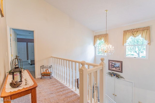 449 Westchester Dr SE, Warren, OH 44484 - hall featuring a chandelier, carpet, and an upstairs landing