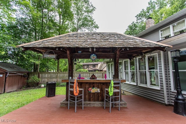 449 Westchester Dr SE, Warren, OH 44484 - deck featuring a fenced backyard, a storage unit, and a gazebo