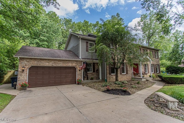 449 Westchester Dr SE, Warren, OH 44484 - view of front of property with a garage, driveway, and brick siding