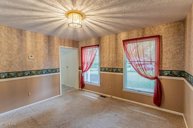 449 Westchester Dr SE, Warren, OH 44484 - carpeted spare room featuring wallpapered walls and a textured ceiling
