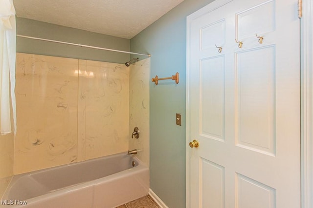 449 Westchester Dr SE, Warren, OH 44484 - bathroom with bathing tub / shower combination, a textured ceiling, and tile patterned floors