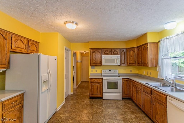 449 Westchester Dr SE, Warren, OH 44484 - kitchen with white appliances, brown cabinets, light countertops, and a textured ceiling